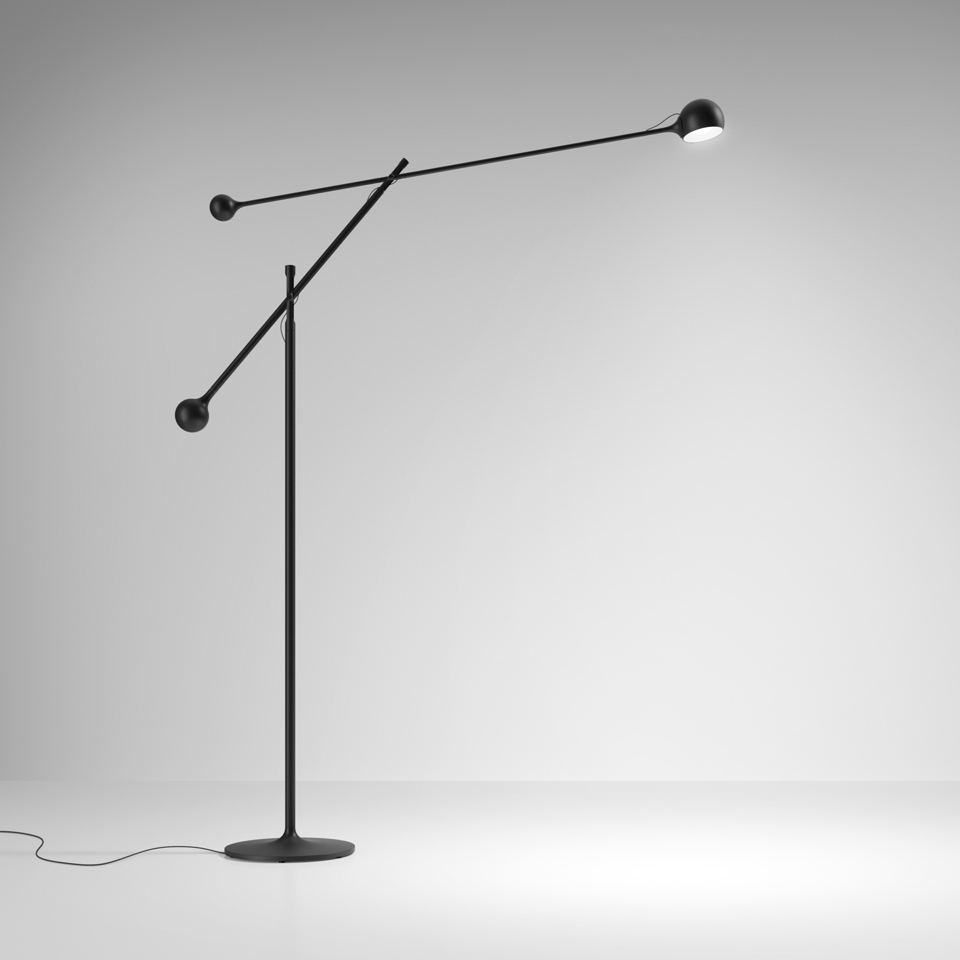 Artemide Ixa floor lamp in black with adjustable articulated arm, counterweight sphere, and directional LED head on circular base