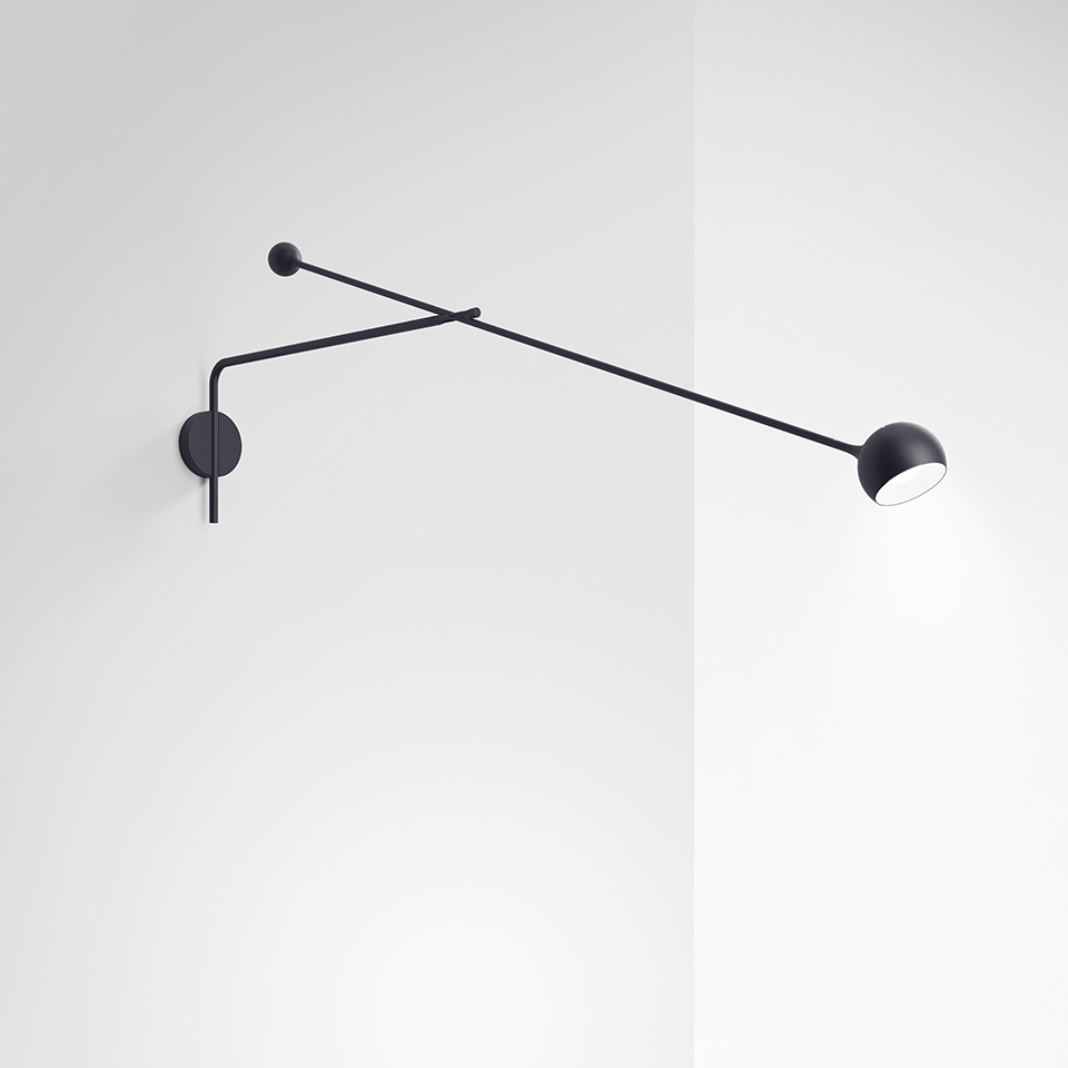 Artemide Ixa wall lamp in black, featuring two articulated arms with a small counterweight sphere and a directional dome-shaped head