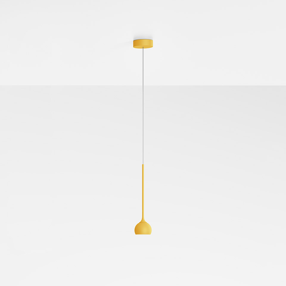 Artemide Ixa pendant lamp in mustard yellow, featuring a slim stem with a small dome shade, suspended from a matching ceiling rose