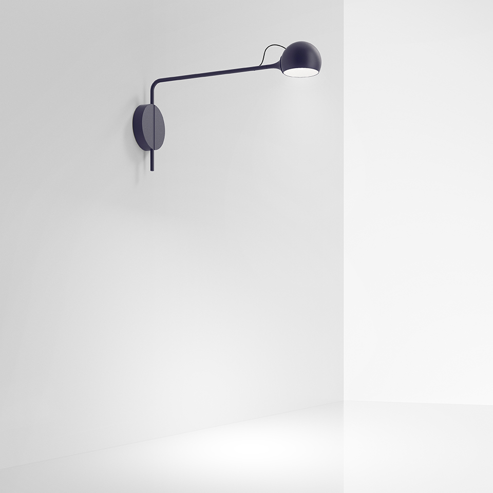 Artemide Ixa wall lamp in dark blue, featuring a long adjustable arm with a spherical rotating head, mounted on a circular wall base