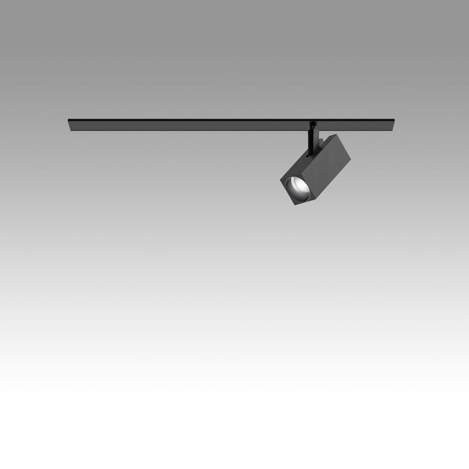 Artemide Katà Métron track lighting system: black rail with adjustable square LED spotlight head, tilted for directional illumination
