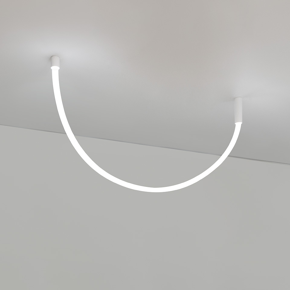Artemide La Linea ceiling lamp: a glowing white semicircular flexible LED tube mounted on a white ceiling with two cylindrical supports