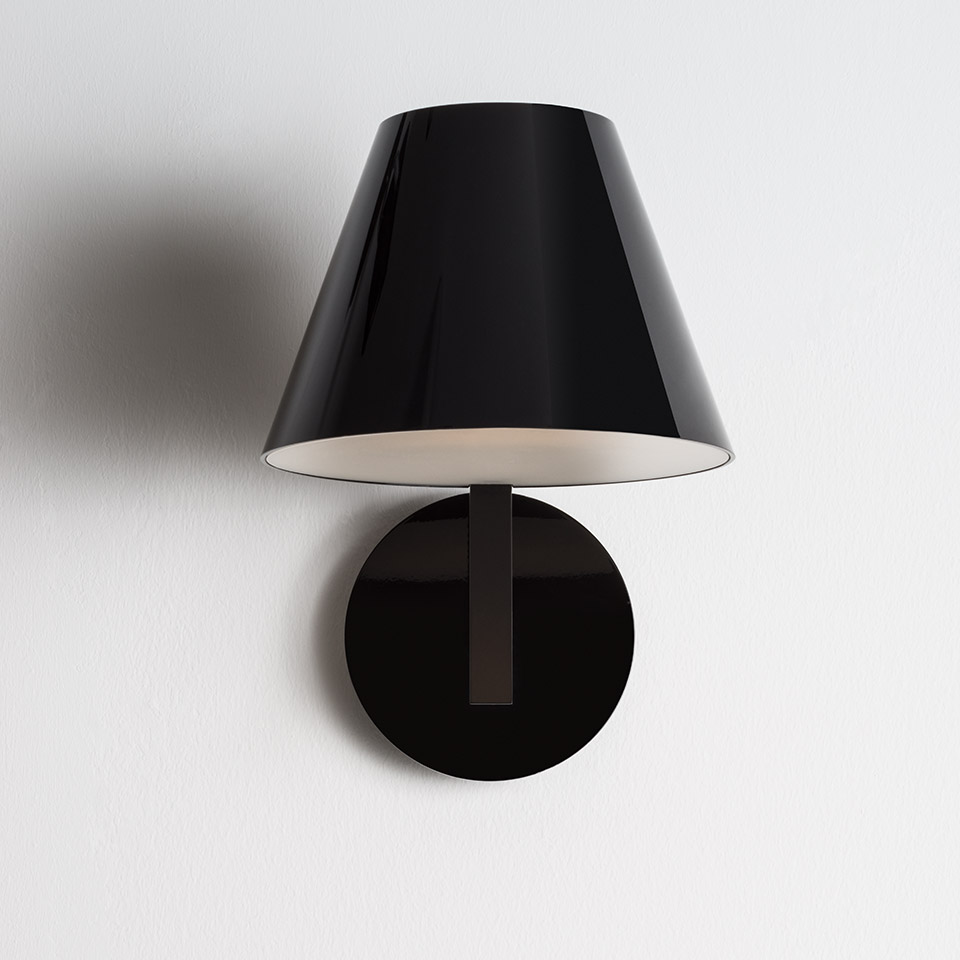 Artemide La Petite Wall lamp: glossy black conical shade with white interior, mounted on a round black wall plate