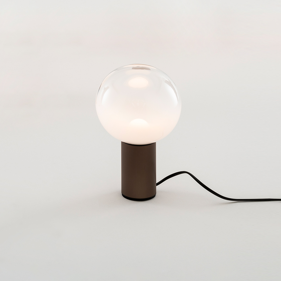Artemide Laguna Tavolo table lamp: clear glass sphere diffuser on a cylindrical dark brown metal base with black cord