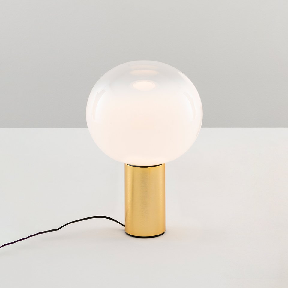 Artemide Laguna Tavolo table lamp: large opal white spherical glass diffuser on a cylindrical brushed gold metal base with black cord