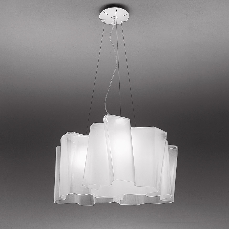 Artemide Logico suspension 3x120°: three overlapping white opal glass shades arranged radially, hanging from chrome ceiling rose on steel cables