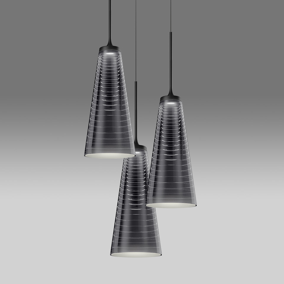 Three Artemide Look at Me pendant lamps with conical smoked glass shades and horizontal ribbing, suspended on black cords at varying heights
