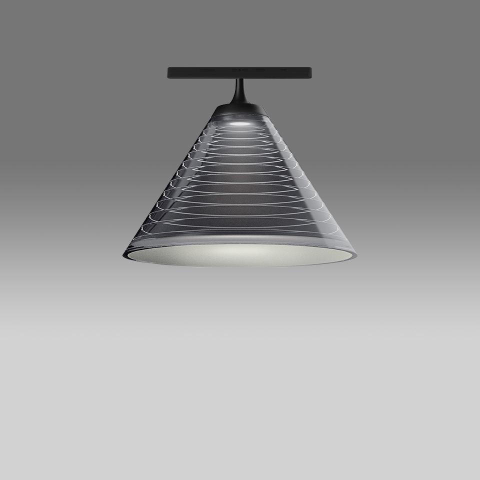 Artemide Look at Me System: conical smoked glass shade with spiral wire pattern, mounted on black ceiling track fitting, emitting downward light