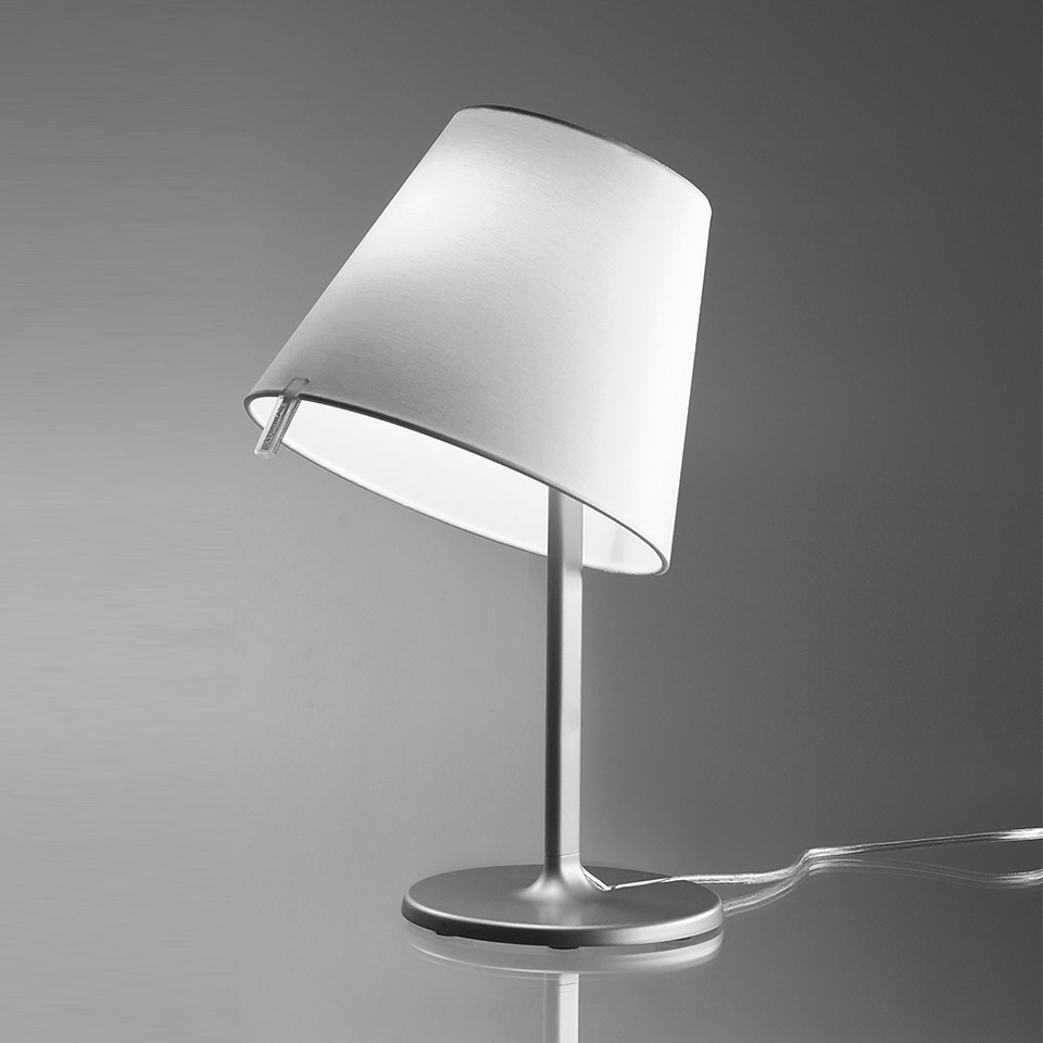 Artemide Melampo Tavolo table lamp with tilted white conical shade on a slim aluminum stem and round base