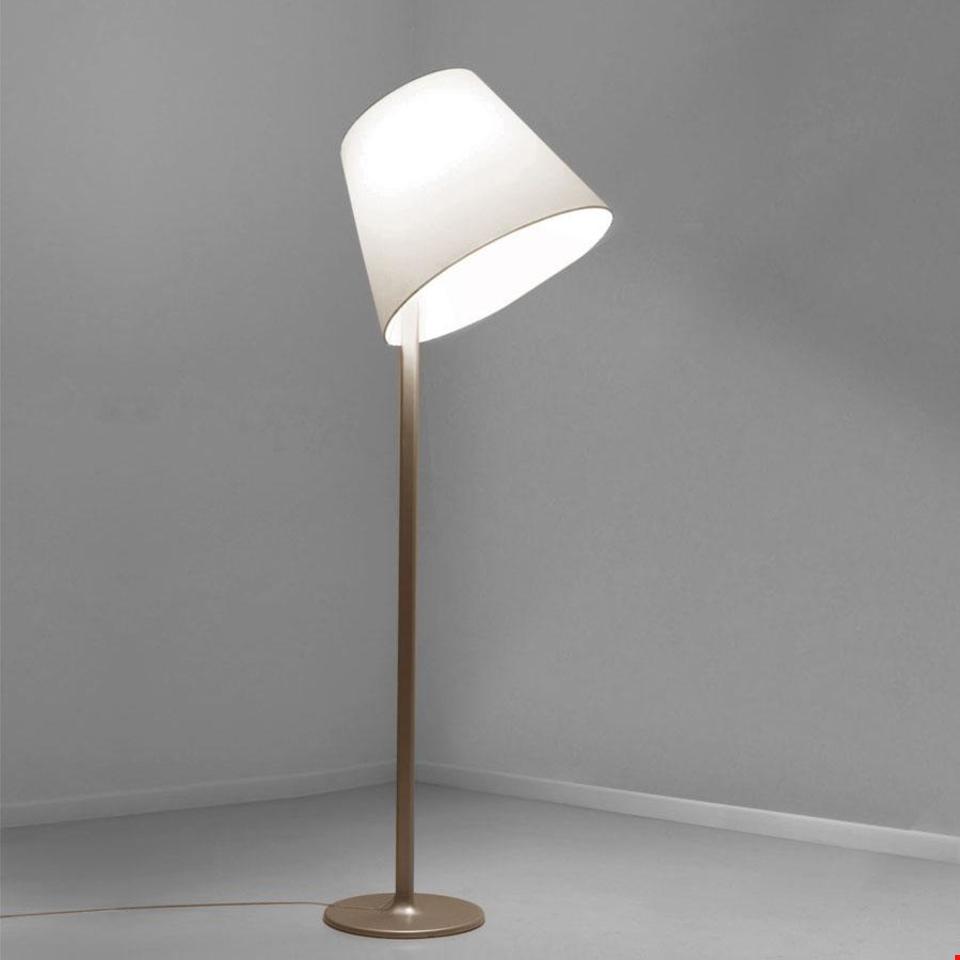 Artemide Melampo Terra floor lamp with white conical fabric shade and slender satin gold metal stem on round base