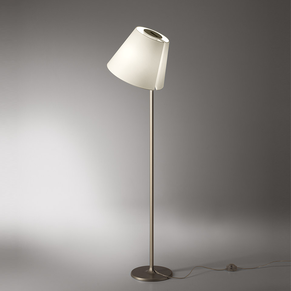 Artemide Melampo Terra floor lamp with tilted white conical shade and slender brushed metal stem on round base