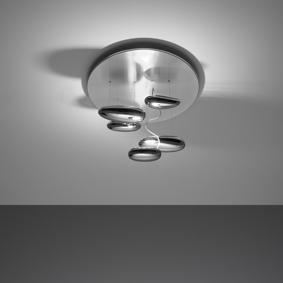 Artemide Mercury Mini ceiling lamp with four polished chrome disc-shaped diffusers suspended at varying heights from a round ceiling rose