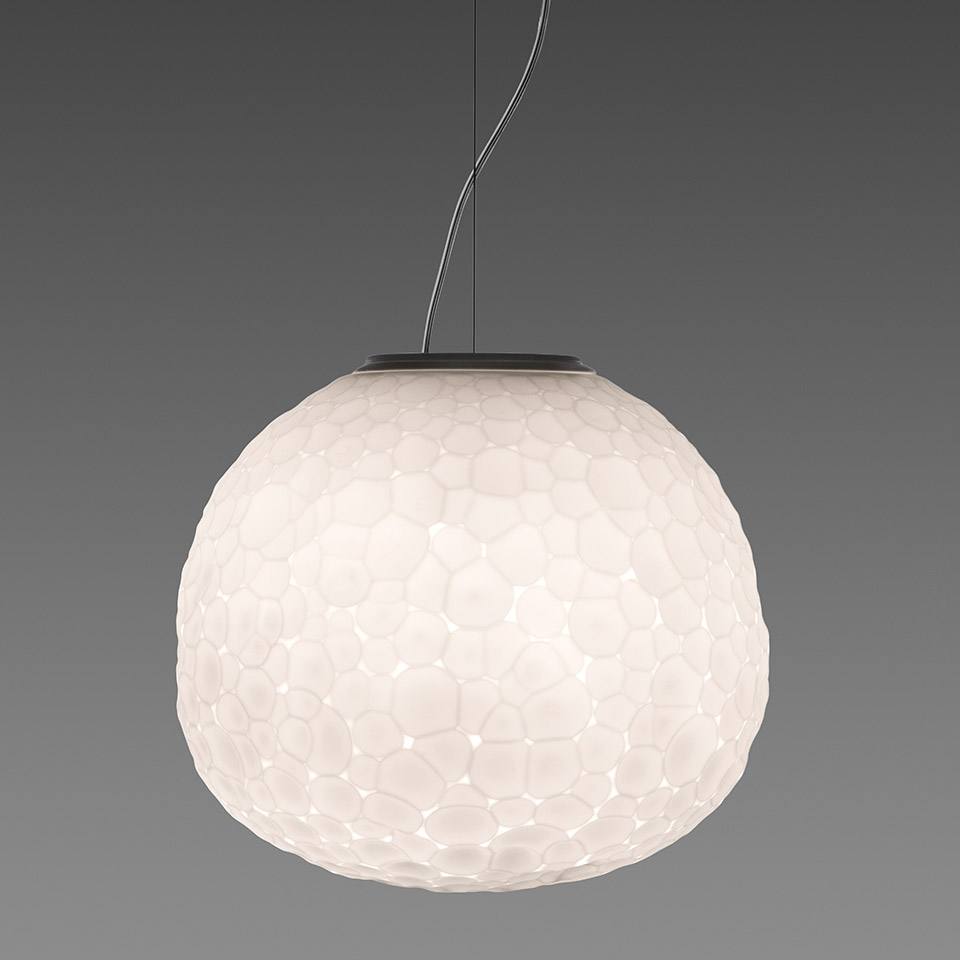 Artemide Meteorite pendant lamp: large spherical white diffuser with organic pebble-textured surface, suspended by dark cable