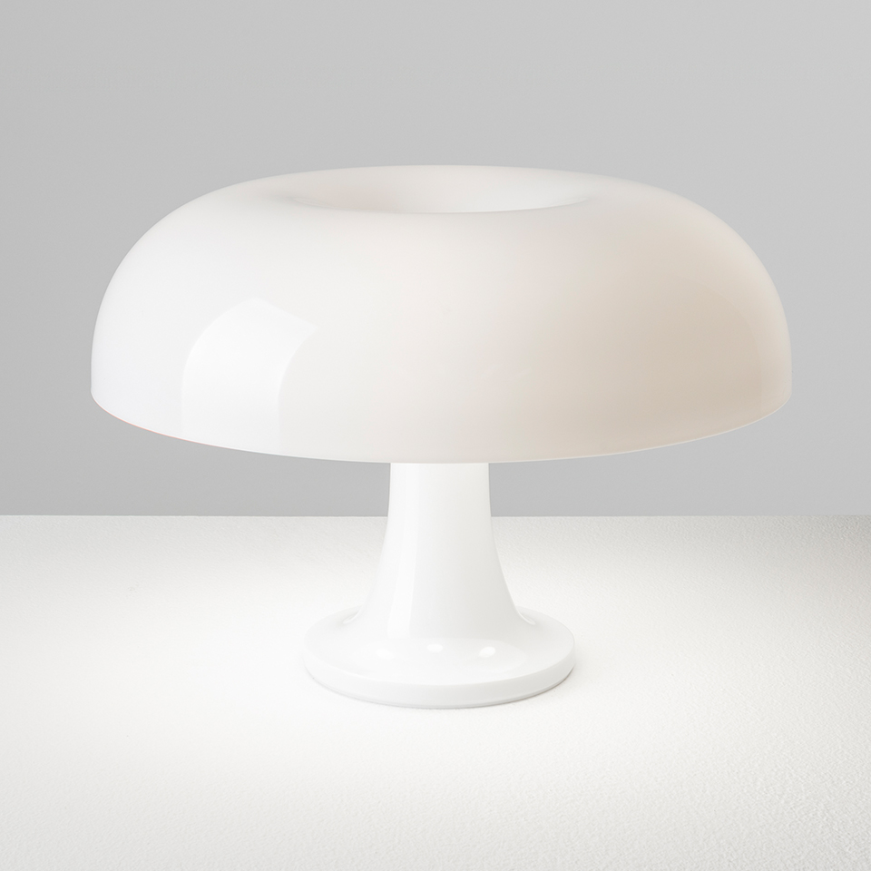Artemide Nessino table lamp: white glossy mushroom-shaped diffuser on a slender pedestal base, emitting soft diffused light - 2