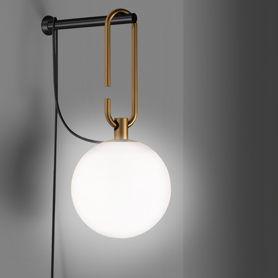 Artemide NH Parete wall lamp: opal white glass globe suspended from a brass U-shaped hook on a black wall-mounted bar