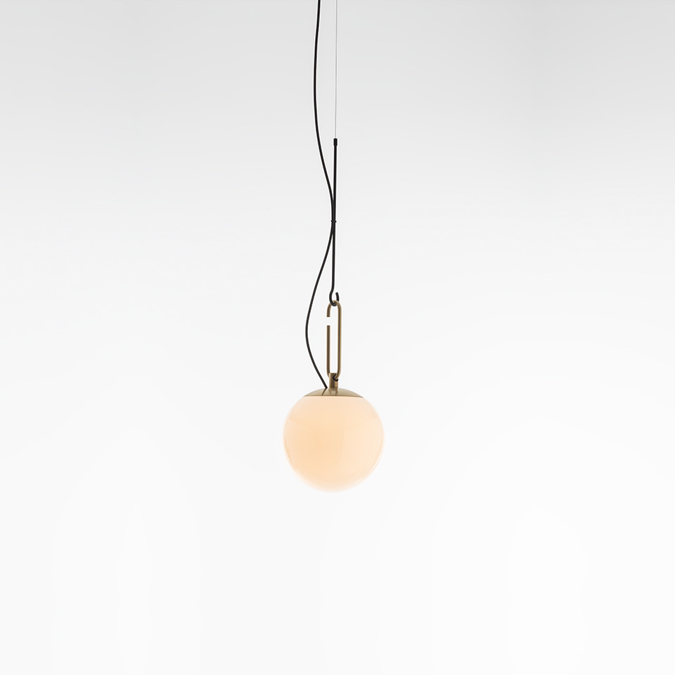 Artemide NH pendant lamp: opal white glass sphere suspended by black cord with antique brass oval ring hardware