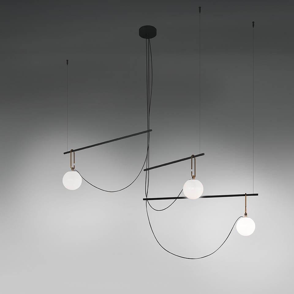 Artemide NH suspension lamp: three opal glass spheres on asymmetric black metal bars with brass joints, suspended by thin black cables