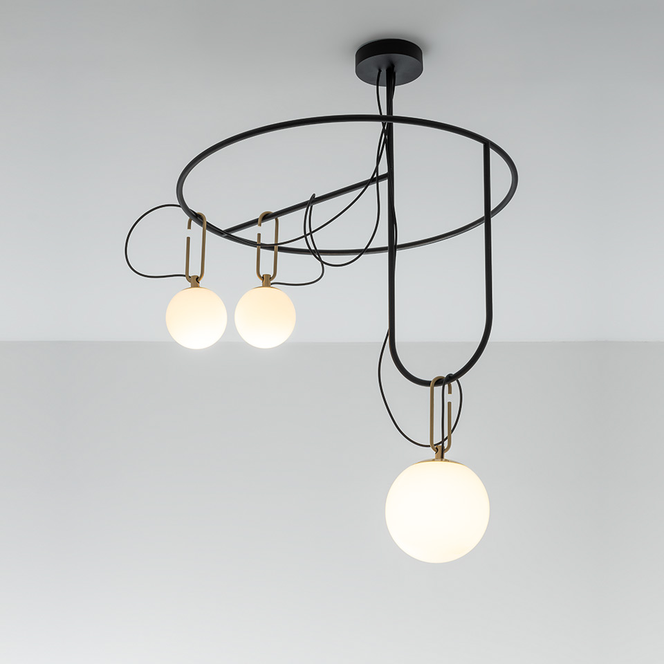 Artemide NH ceiling lamp: black circular frame with three opal glass globe pendants suspended by brass hooks on black cables