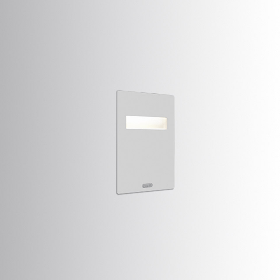 Artemide Nuda recessed wall light, white rectangular faceplate with a slim horizontal LED strip emitting soft diffused light