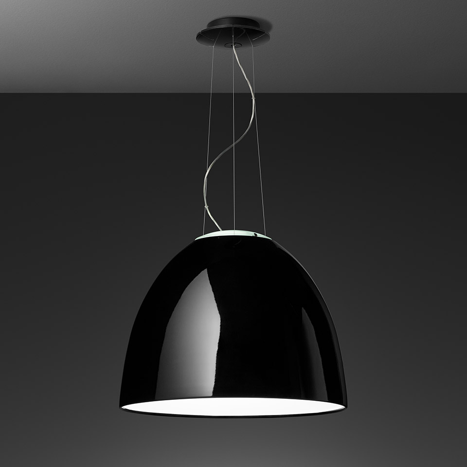 Artemide Nur Gloss pendant lamp with glossy black dome shade and white interior, suspended from ceiling by thin cables