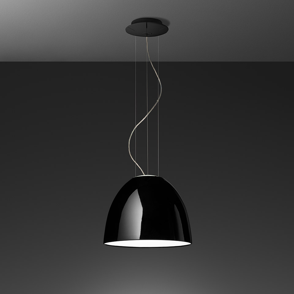 Artemide Nur Gloss pendant lamp with glossy black dome shade, white interior, suspended by thin cables from a black ceiling canopy