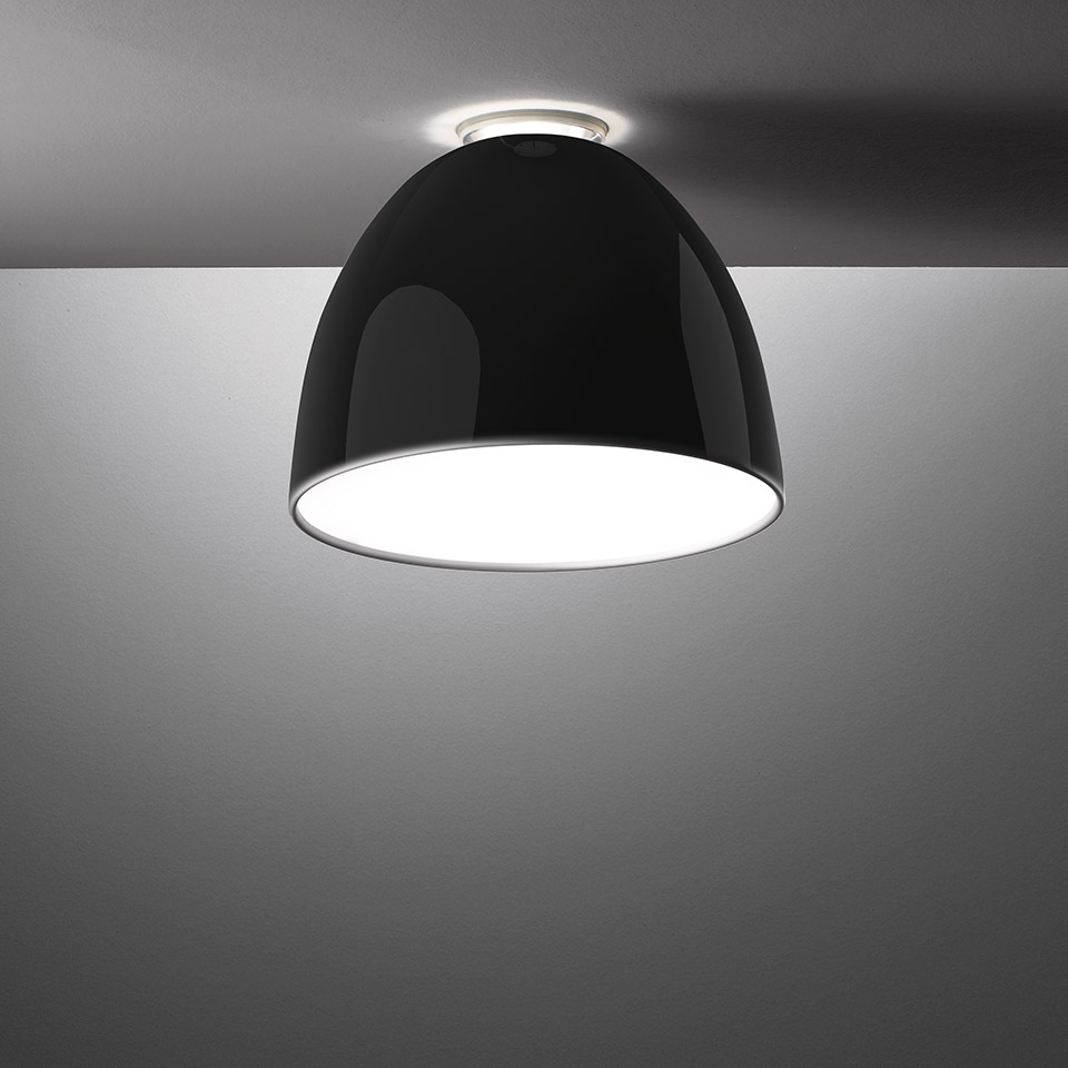 Artemide Nur Mini Gloss ceiling lamp with glossy black dome-shaped shade and white interior, mounted flush to the ceiling