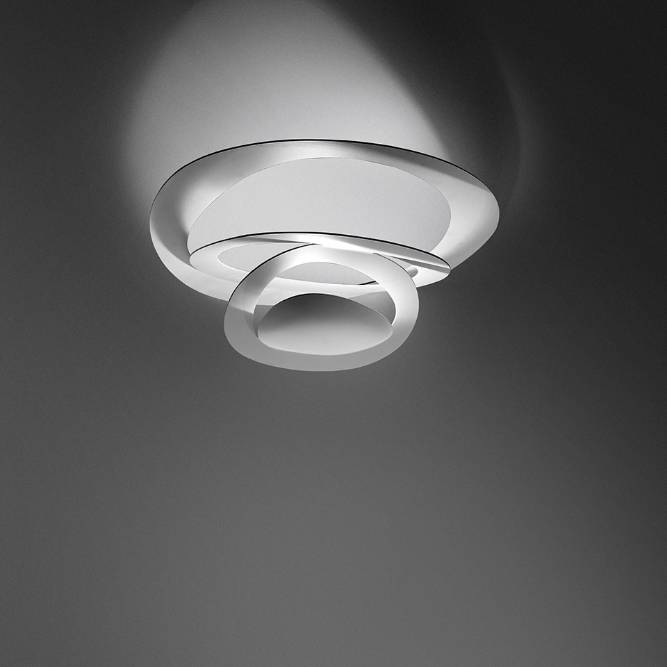 Artemide Pirce Soffitto ceiling lamp in white, featuring a sculptural spiral design that projects soft ambient light upward.