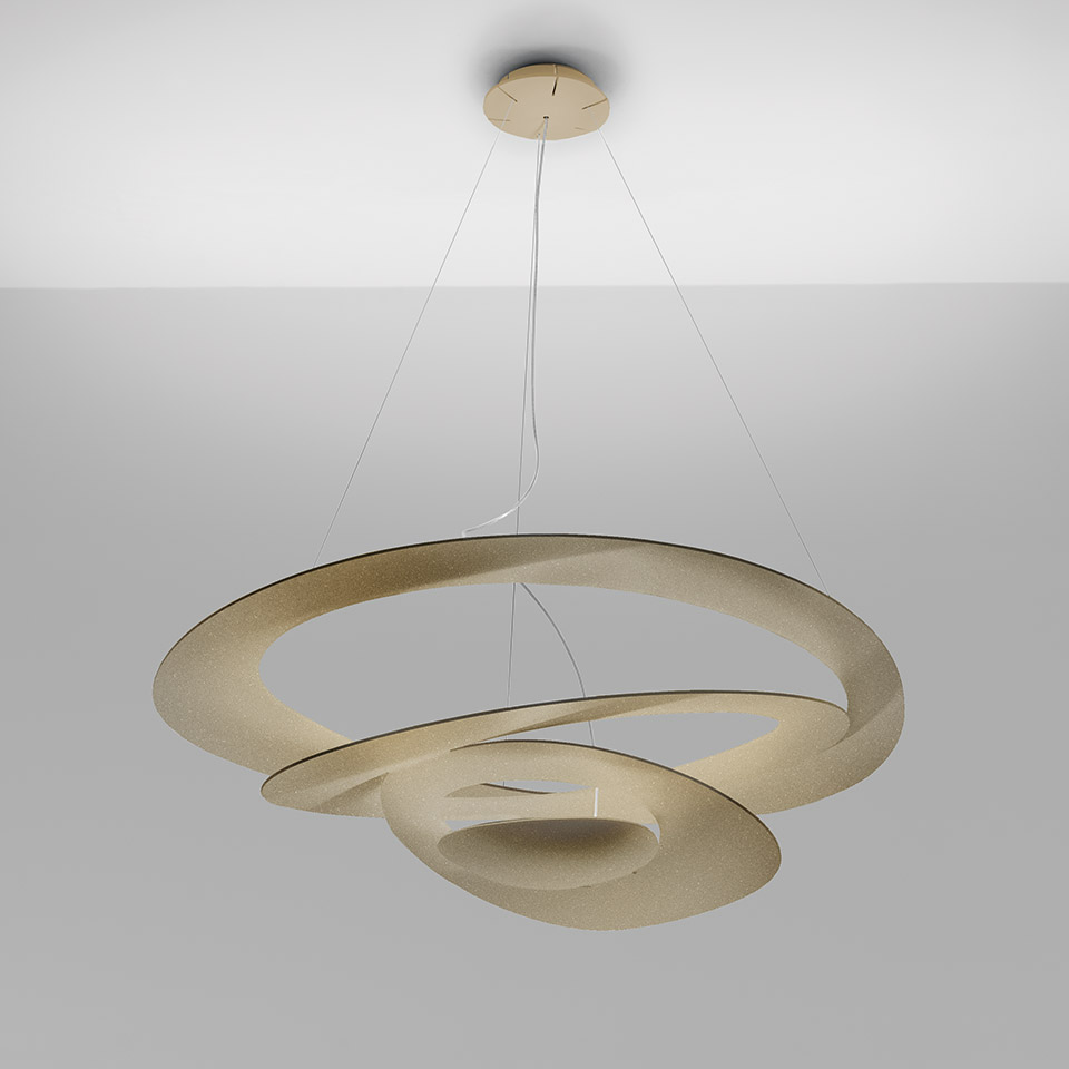 Artemide Pirce pendant lamp in gold finish, featuring an elegant spiral ribbon shade suspended by thin cables from ceiling