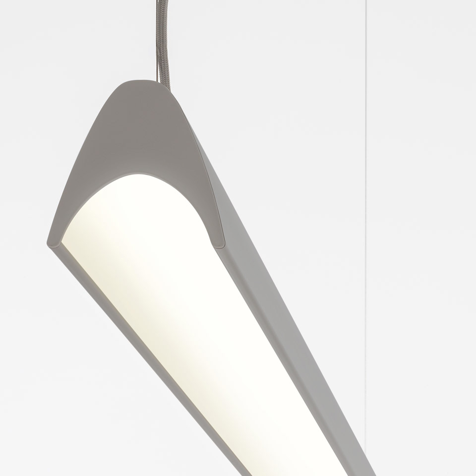 Artemide Series Y pendant lamp: angled grey metal body with open cylindrical white diffuser, suspended by a braided cable