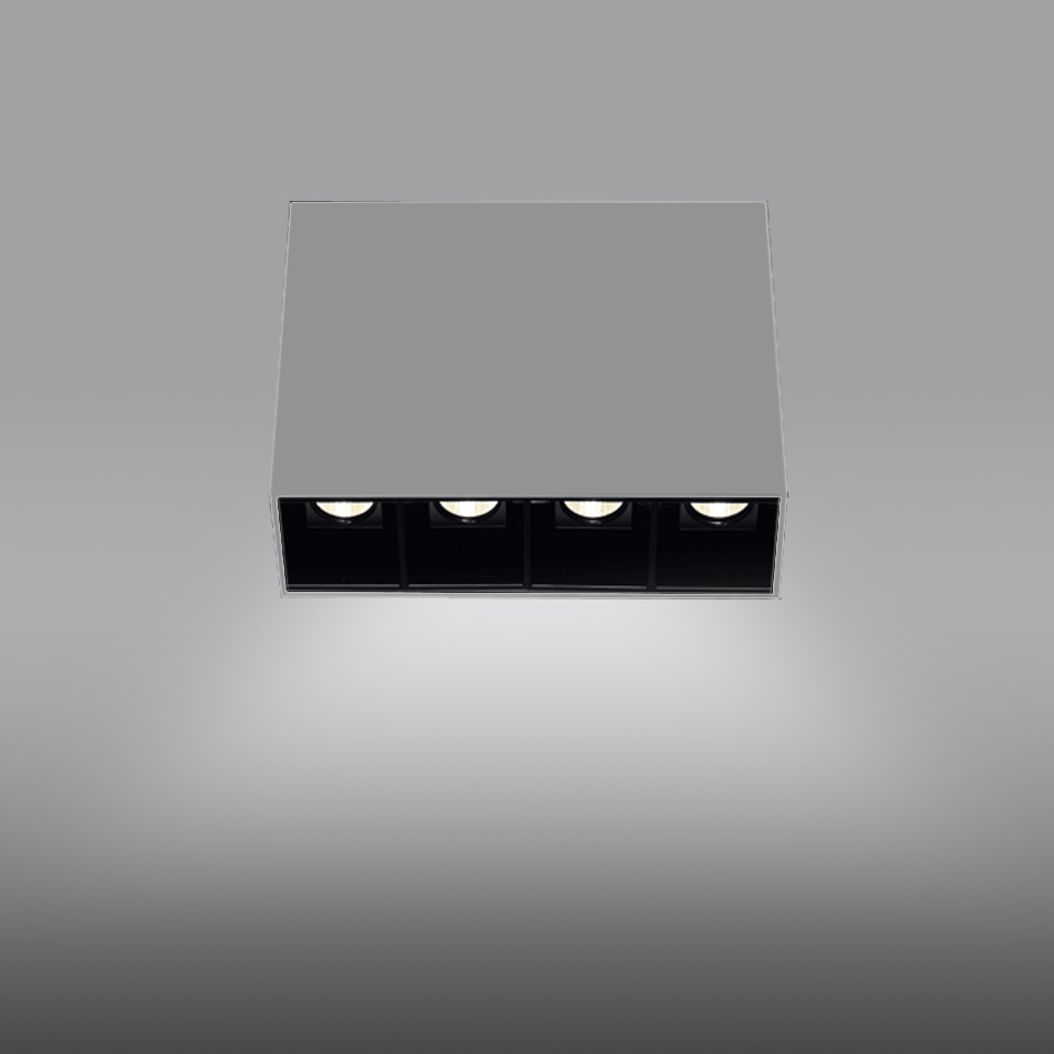 Artemide Sharp SMD ceiling light: square white housing with four recessed black LED spotlights emitting focused downward beams
