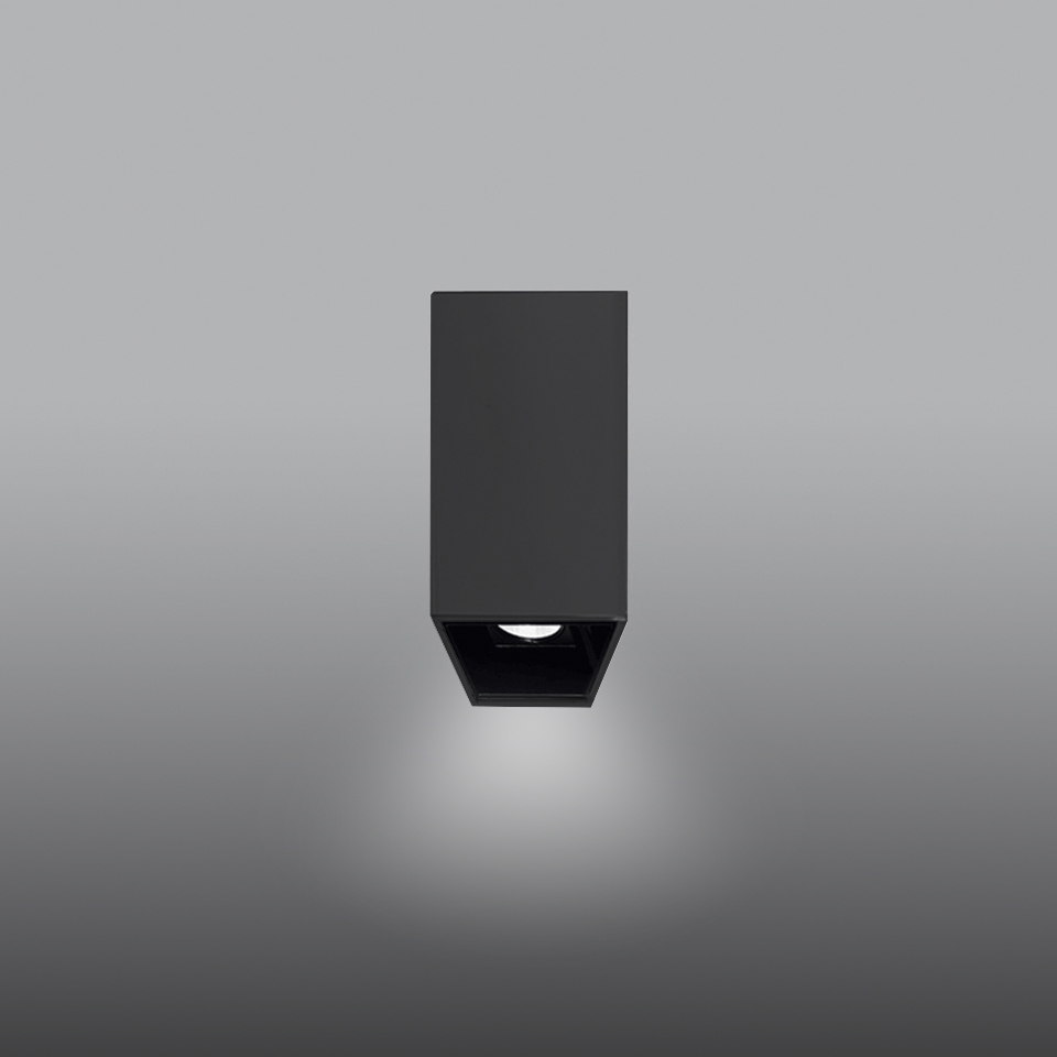 Artemide Sharp SMD ceiling spotlight in black, compact rectangular body with downward-facing LED light source casting focused beam