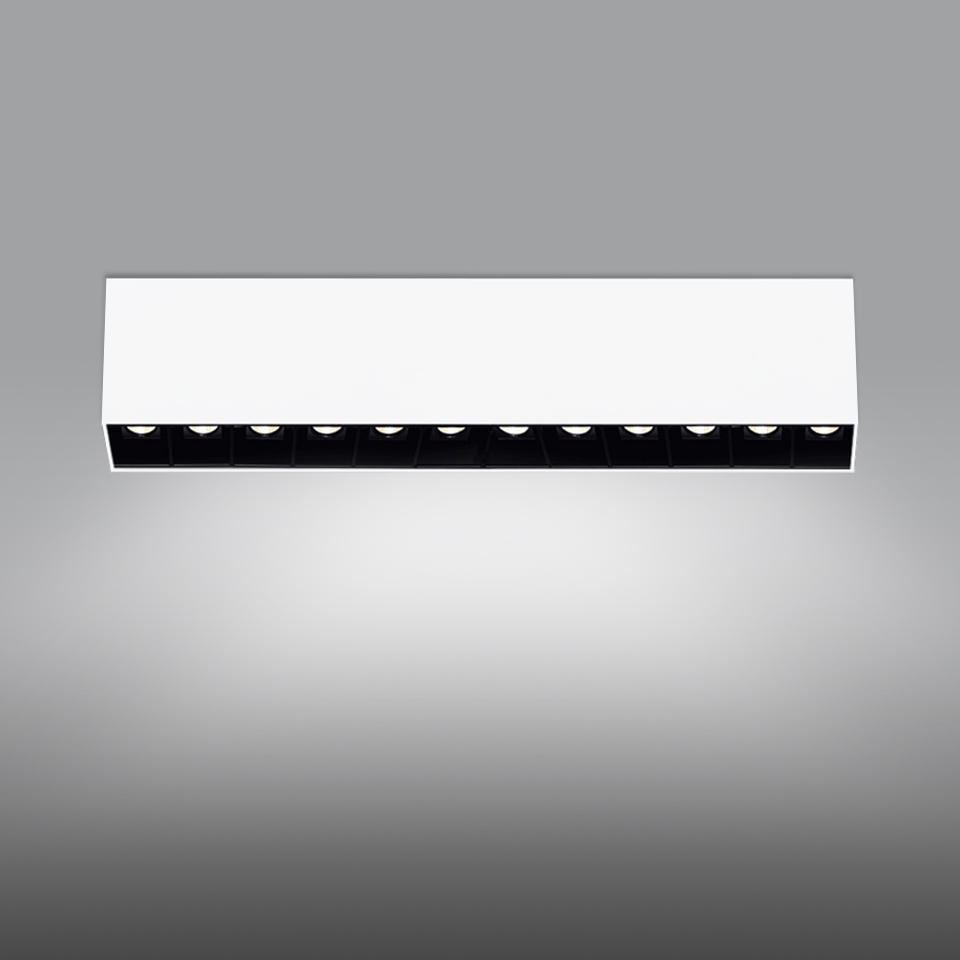 Artemide Sharp SMD ceiling light: rectangular white housing with 10 black-recessed LED modules emitting focused downward beams