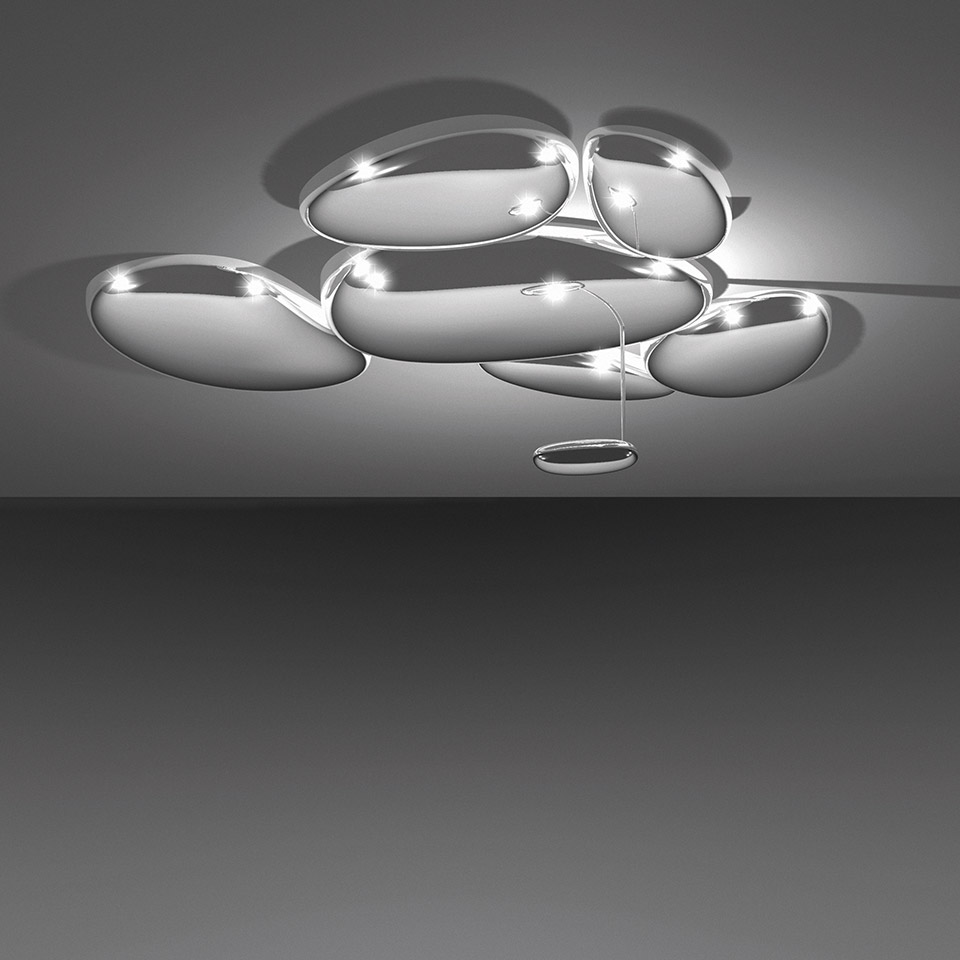 Artemide Skydro ceiling lamp: cluster of polished chrome oval discs mounted on ceiling with integrated LED lights casting dramatic shadows