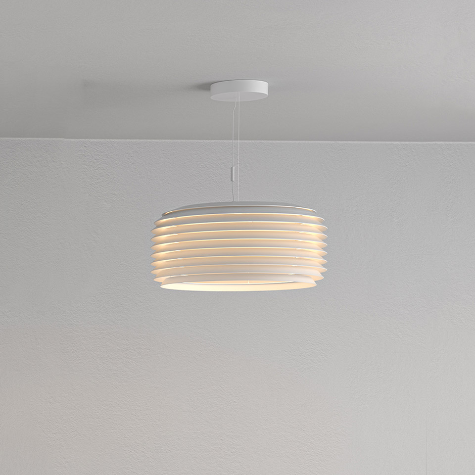 Artemide Slicing pendant lamp in white, featuring layered horizontal slats forming a cylindrical shade, emitting warm diffused light.