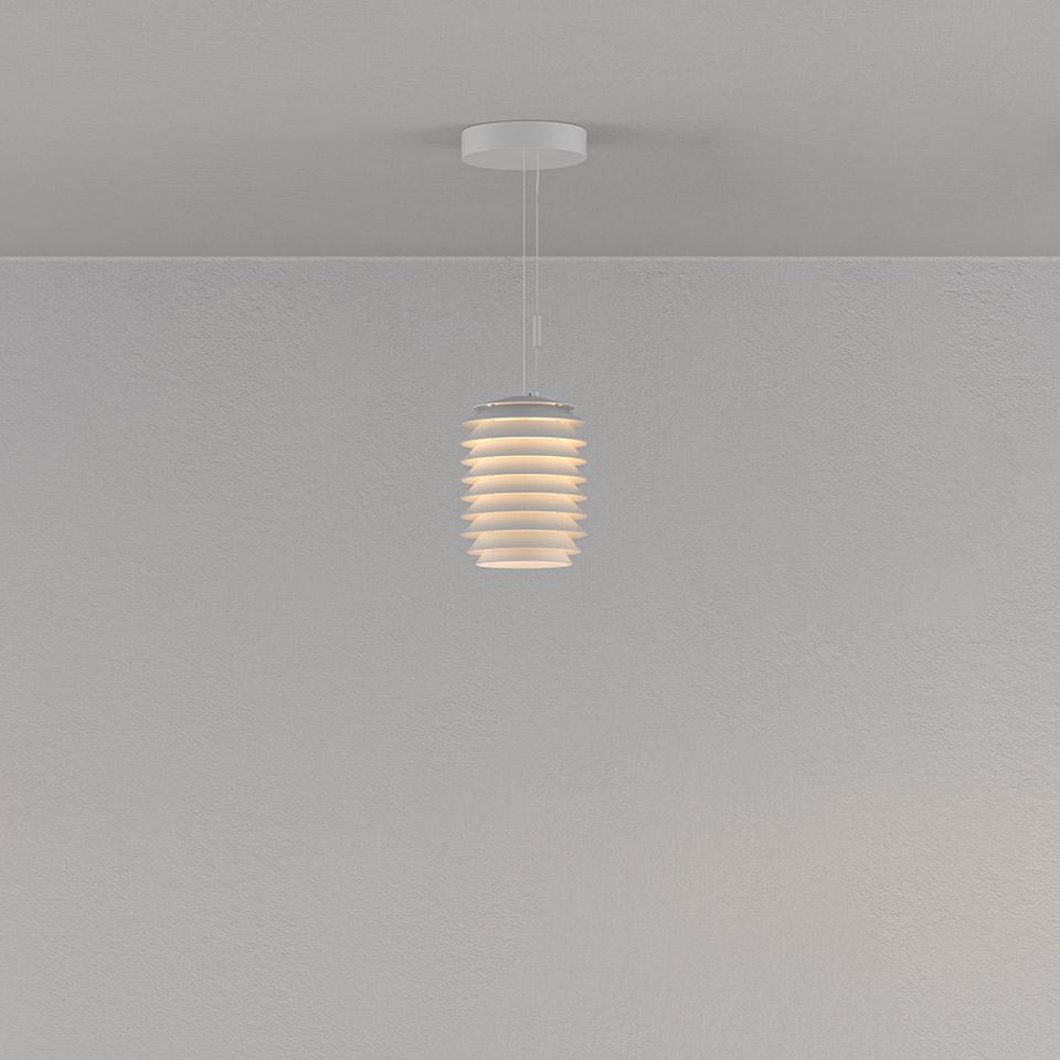 Artemide Slicing pendant lamp in white, featuring layered horizontal rings forming a cylindrical shade, emitting warm diffused light