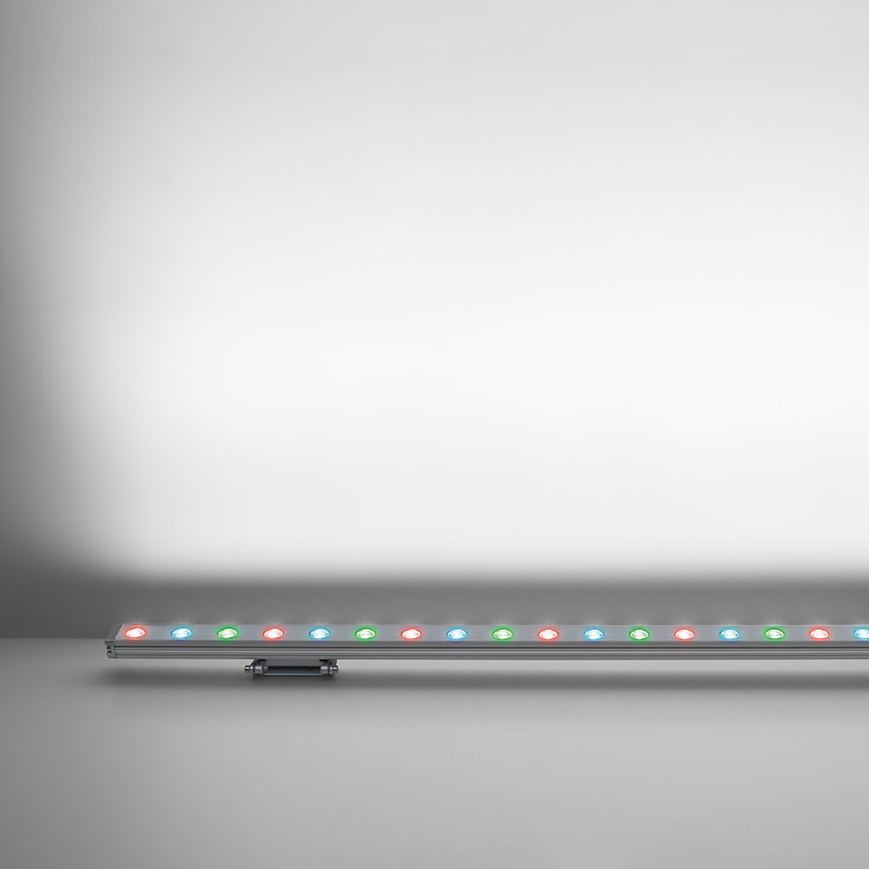 Artemide Spike linear LED bar with RGB multicolor LEDs in a slim aluminum profile, designed for architectural wall washing
