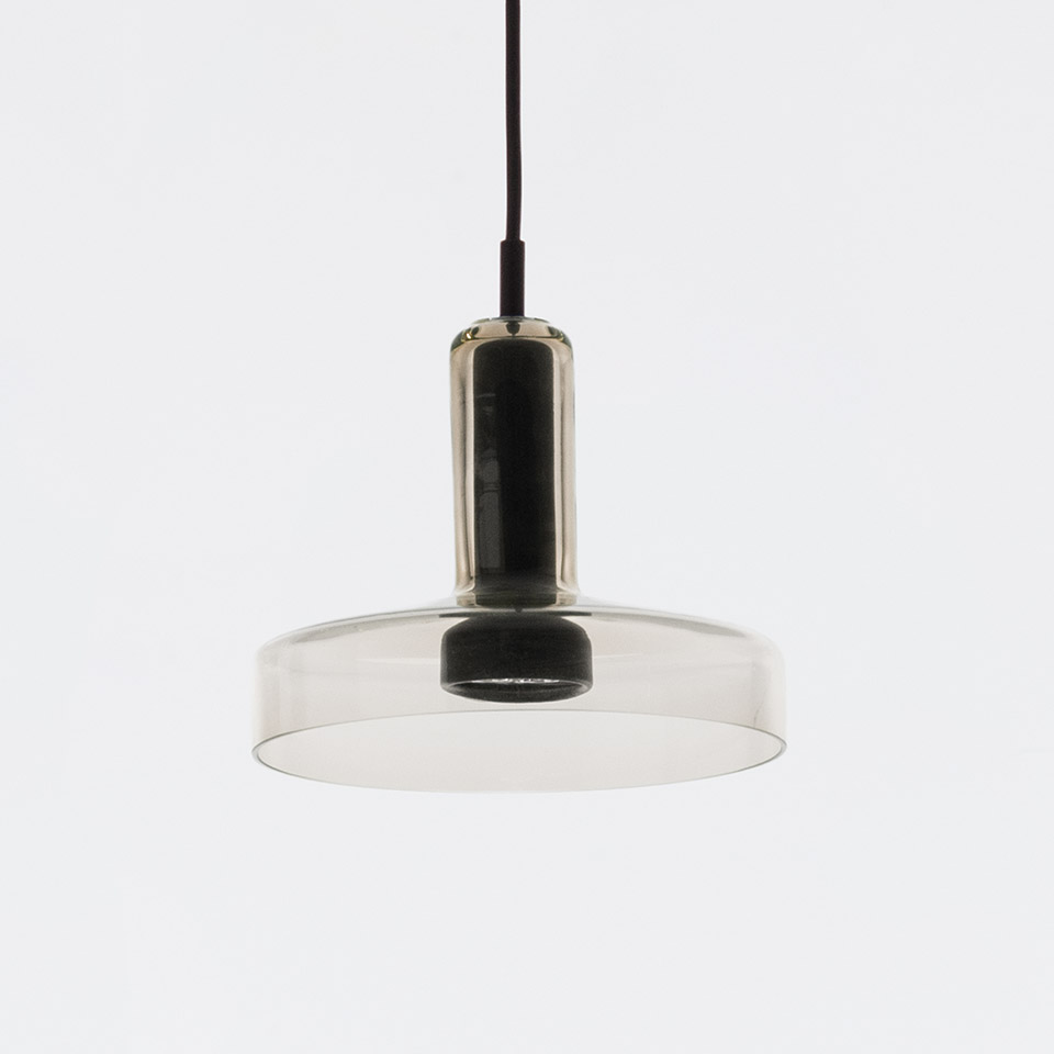 Artemide Stablight pendant lamp: smoked glass disc shade with cylindrical black metal stem, suspended by a dark cord