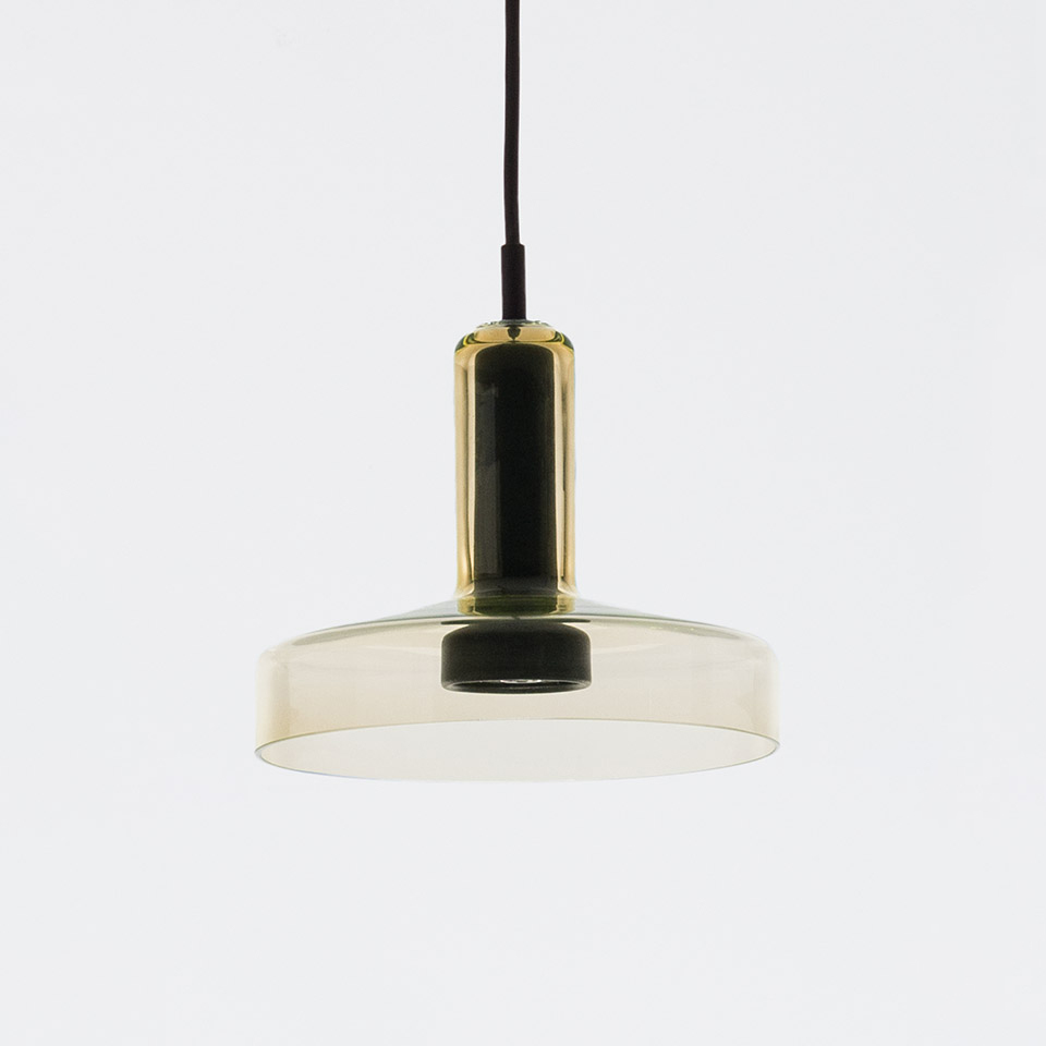 Artemide Stablight pendant lamp: smoked glass cylindrical stem and flat disc diffuser in amber-green tint, suspended by black cord