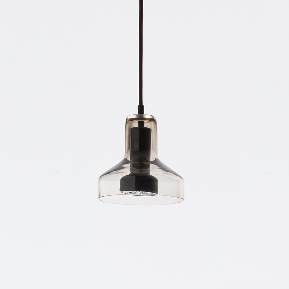 Artemide Stablight pendant lamp with smoked glass shade, black metal fitting, and LED light source, suspended from a black cord