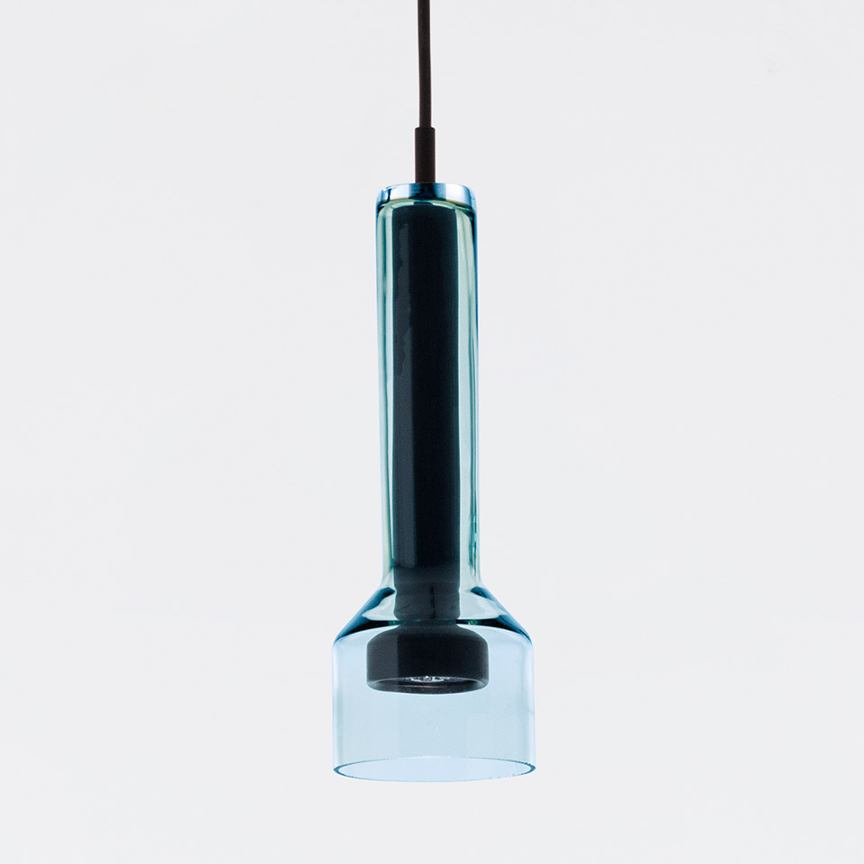 Artemide Stablight pendant lamp: cylindrical blue-teal glass body with wide cup-shaped base, suspended from black cord