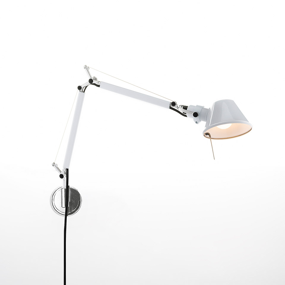 Artemide Tolomeo Micro Parete wall lamp in white, with adjustable articulated arm and conical shade, mounted on a chrome wall bracket