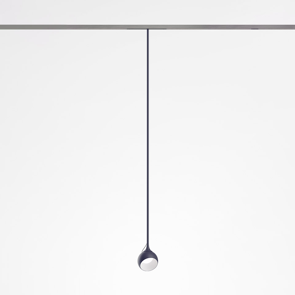 Artemide Turn Around System: dark blue teardrop-shaped pendant lamp hanging from a ceiling track via a slim cord