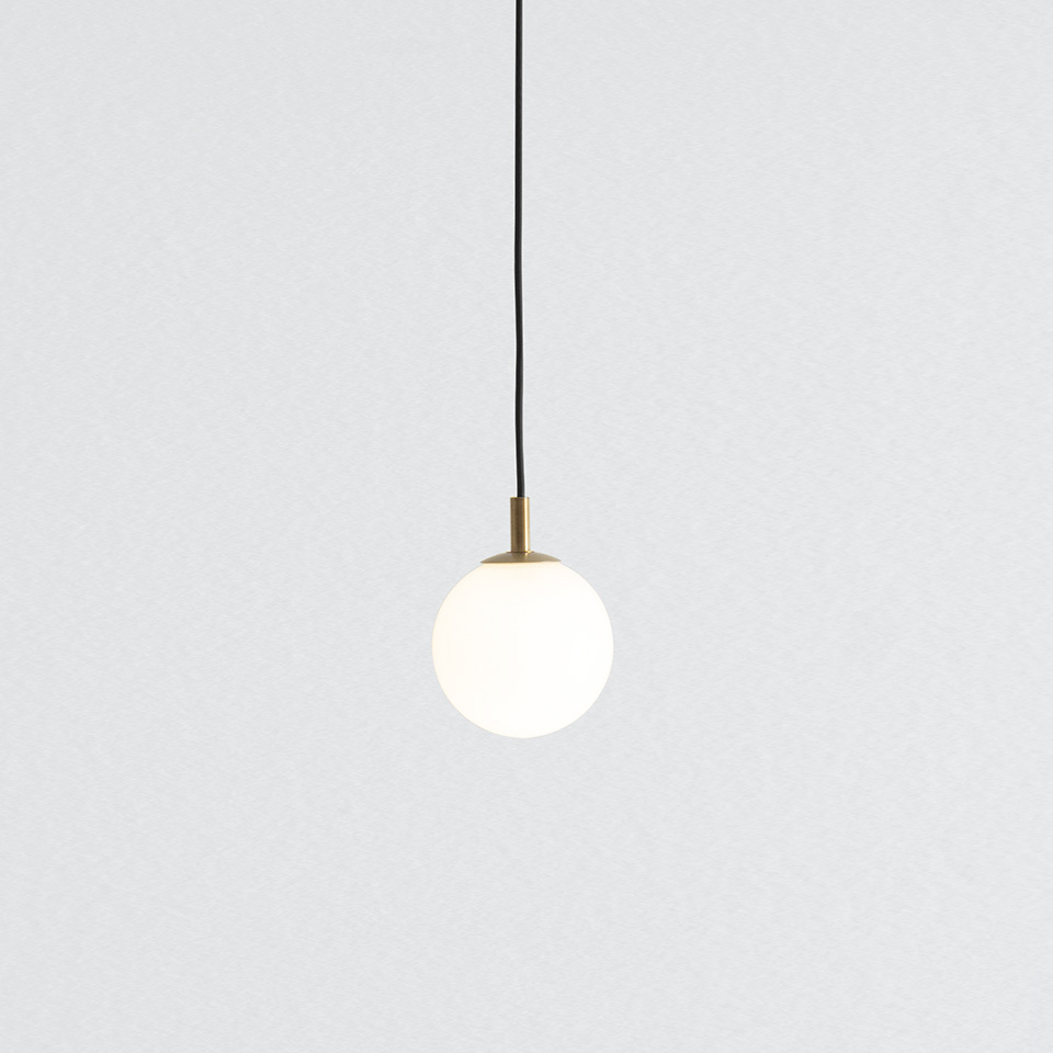 Artemide Turn Around pendant lamp: opal white glass sphere diffuser with brass fitting, suspended by a black cord
