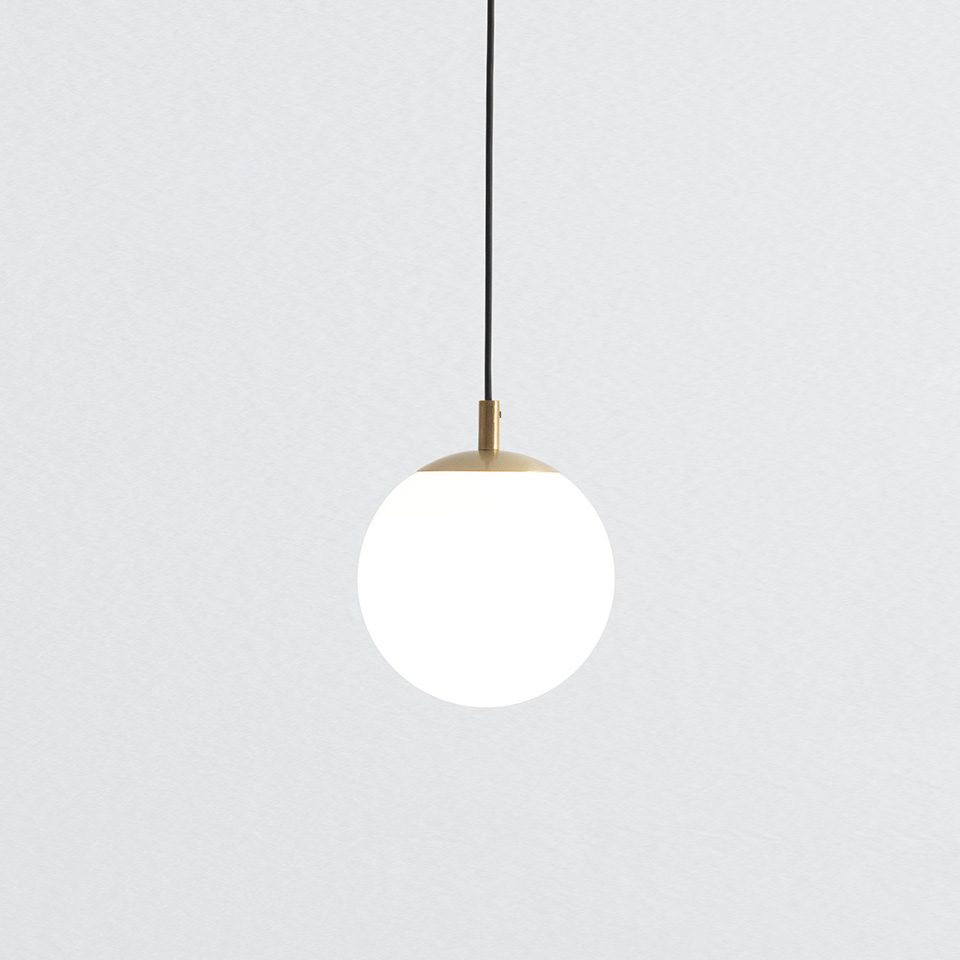 Artemide Turn Around pendant lamp: opal white glass sphere with brushed gold brass cap, suspended on a black cord