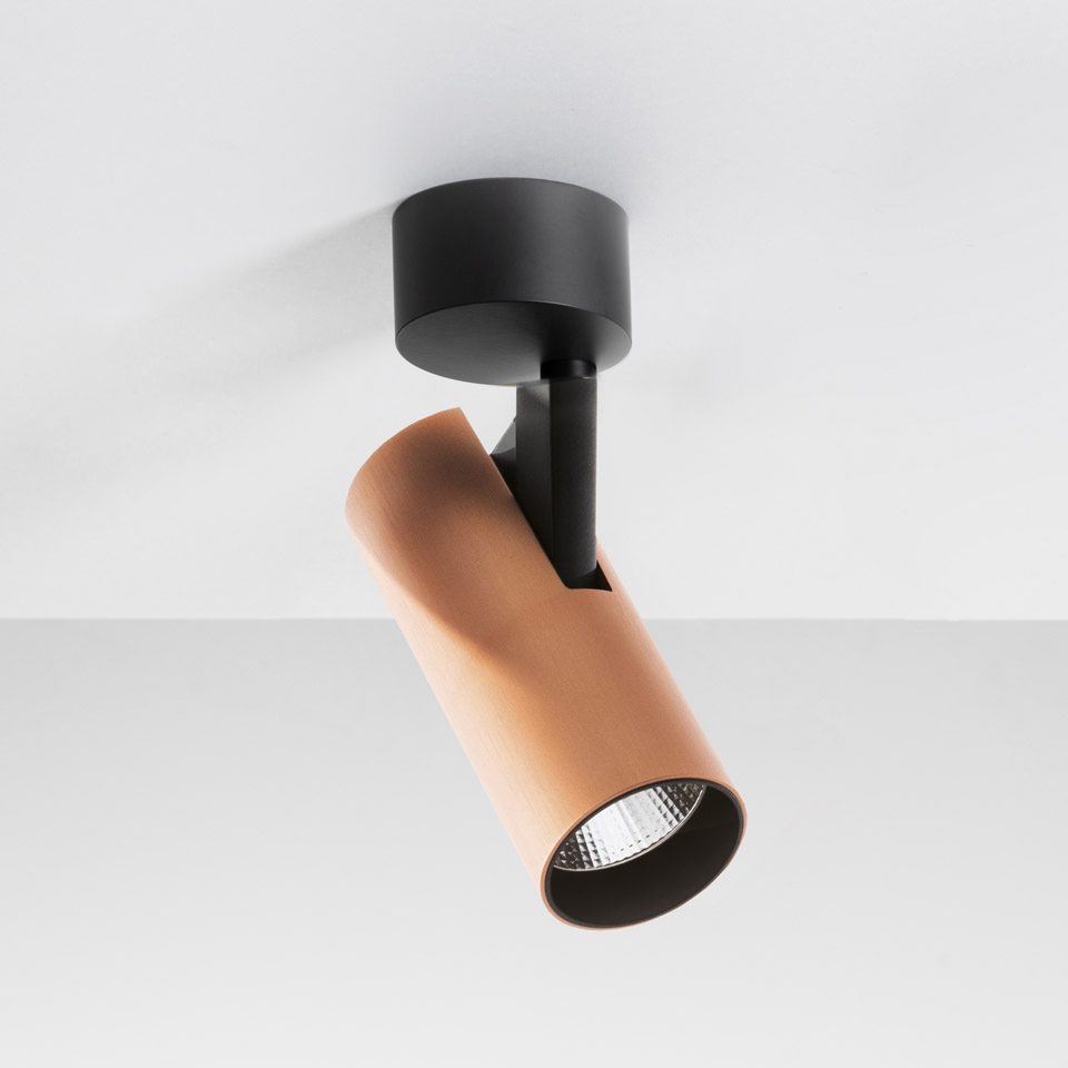 Artemide Vector Ceiling spotlight: adjustable copper-tone cylindrical head on black ceiling mount, directional LED surface light