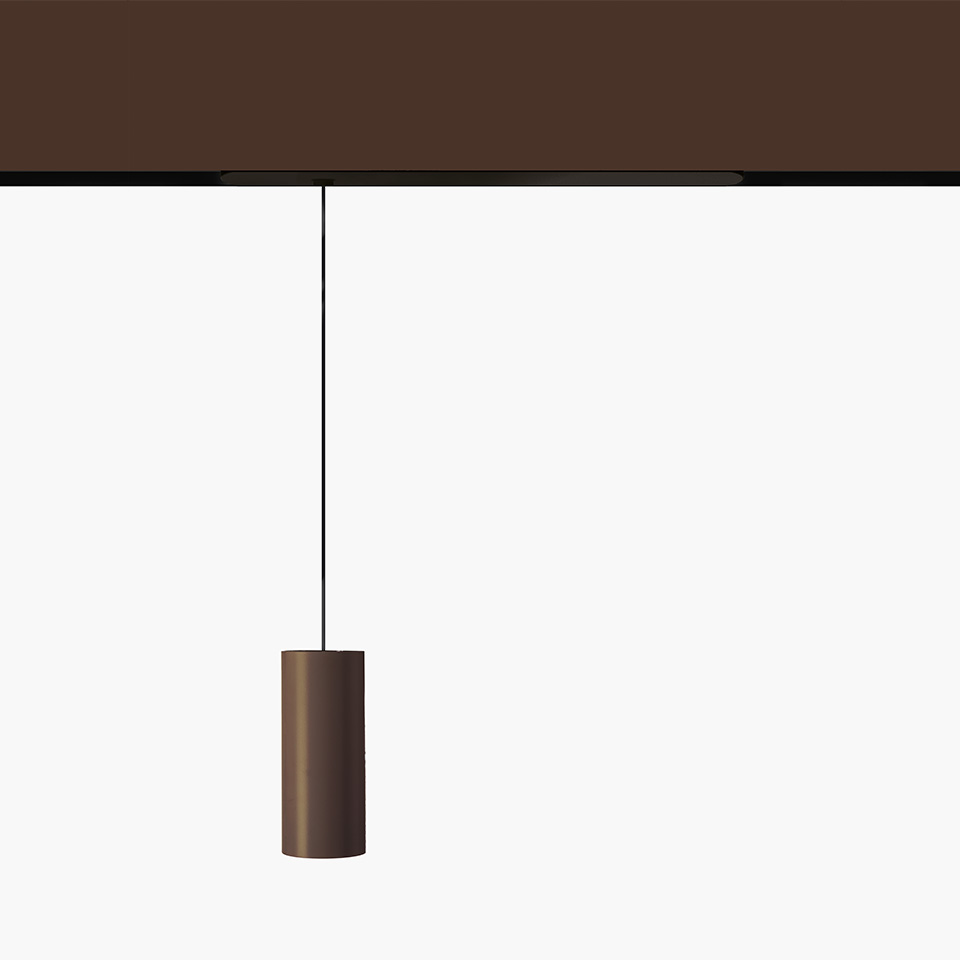 Artemide Vector Pendant Magnetic: cylindrical bronze pendant lamp hanging from a magnetic track system via a thin black cord