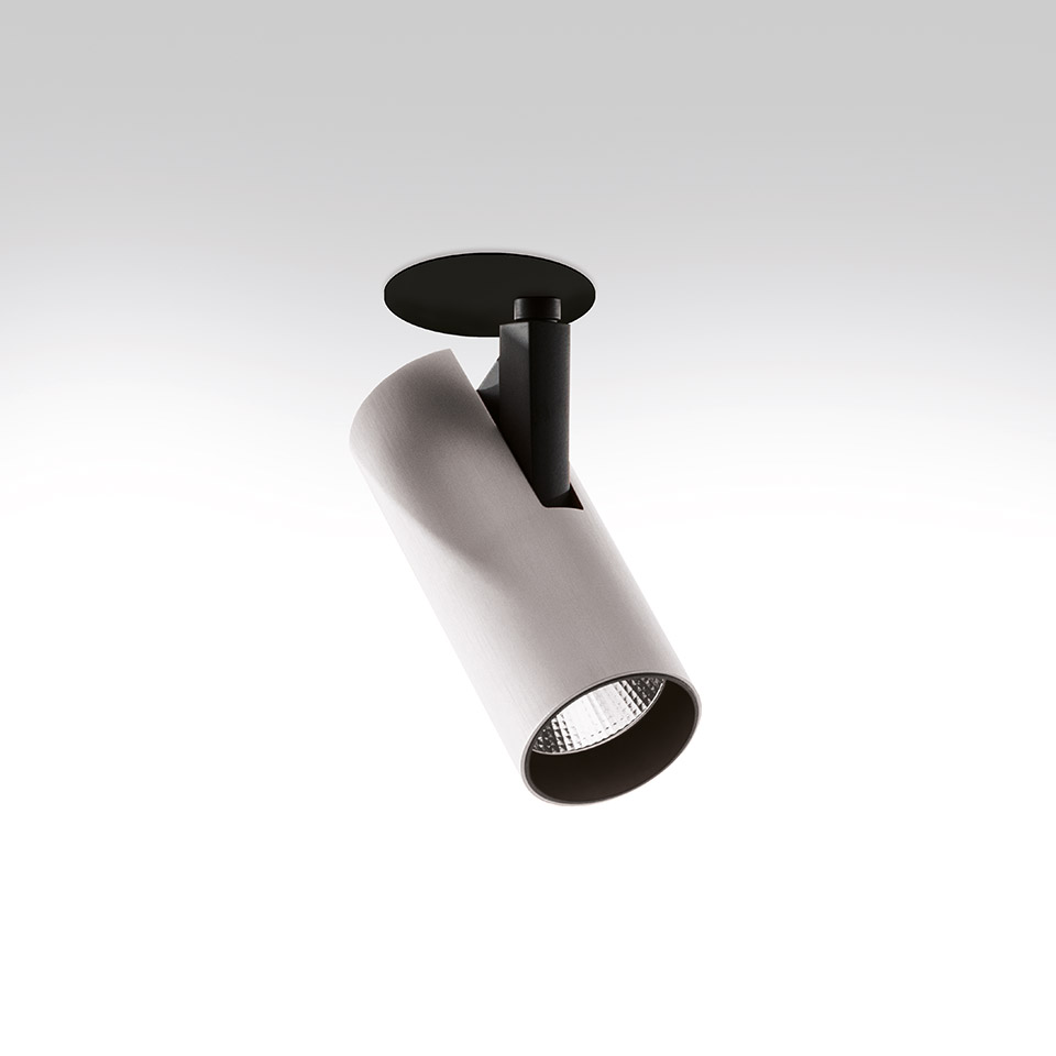 Artemide Vector Semirecessed spotlight: white cylindrical adjustable head on black recessed mount, angled downward with LED light source