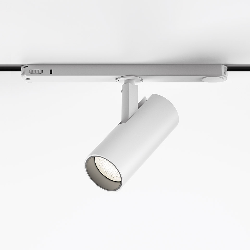 Artemide Vector Track 230V white LED track spotlight mounted on ceiling rail, cylindrical body with adjustable tilt