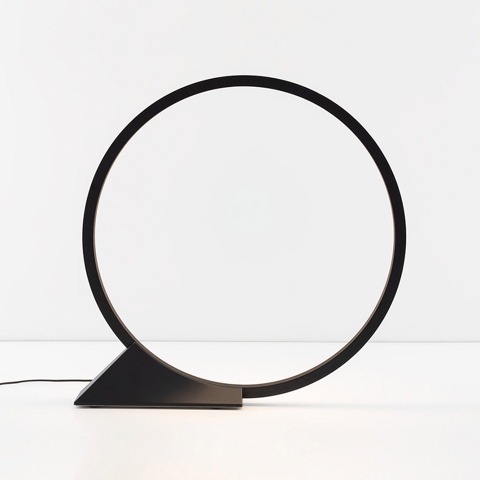 Artemide O table lamp: black circular LED ring on a triangular base, minimalist geometric design