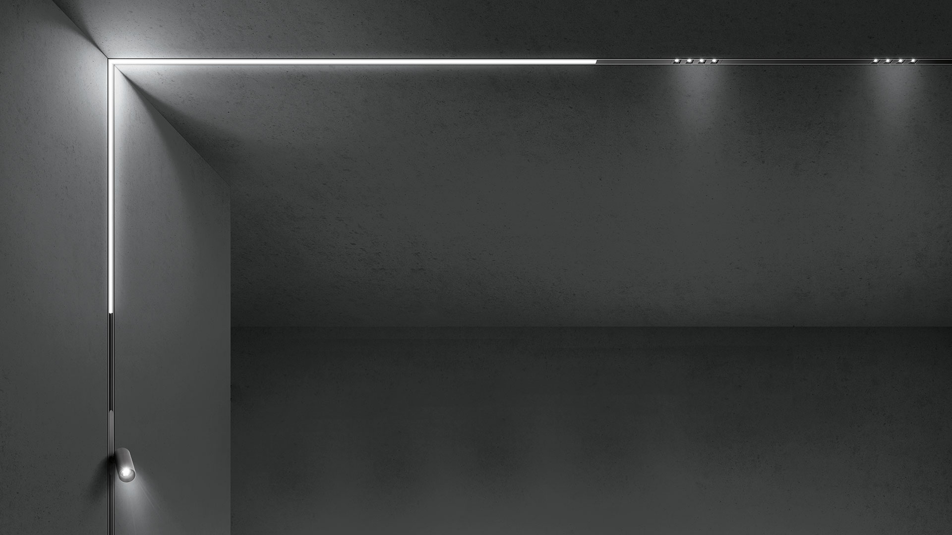 Artemide A.24 system: black ceiling track with spotlights, pendant cylinders, and A.24 Emissione Diffusa wall and linear lights
